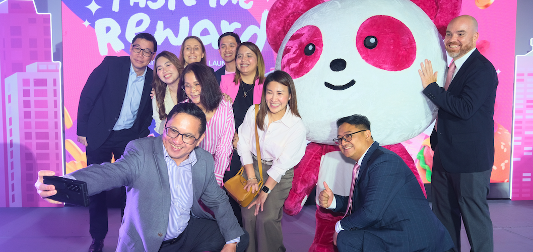 Representatives from foodpanda Philippines, EastWest, and Visa join Pau-Pau for a group photo during the launch of the EastWest foodpanda Visa Credit Card